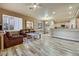 Spacious living room seamlessly connecting the dining area and kitchen at 801 Sir James Bridge Way, Las Vegas, NV 89145