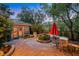 Stone patio features a fountain and mature landscaping at 801 Sir James Bridge Way, Las Vegas, NV 89145