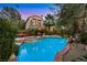 Gorgeous outdoor pool and spa with ample patio space and lush greenery at 801 Sir James Bridge Way, Las Vegas, NV 89145