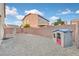 A low maintenance backyard with gravel landscaping and playhouse at 8112 Mustang Hill Ct, Las Vegas, NV 89131