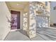 Inviting front entry with a stylish door and convenient access to the garage at 8112 Mustang Hill Ct, Las Vegas, NV 89131