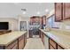 Modern kitchen with granite countertops, stainless steel appliances, and ample cabinet space at 8112 Mustang Hill Ct, Las Vegas, NV 89131