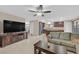 Spacious living room with an open floor plan and a view of the modern kitchen at 8112 Mustang Hill Ct, Las Vegas, NV 89131