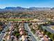 Expansive neighborhood featuring lush greenery, manicured fairways and mountains in the background at 8916 Evening Star Dr, Las Vegas, NV 89134