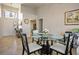 Open dining area featuring a glass-top table and stylish chairs, perfect for entertaining at 8916 Evening Star Dr, Las Vegas, NV 89134