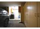 Spacious garage with car, laundry area, and plenty of built in storage cabinets at 8916 Evening Star Dr, Las Vegas, NV 89134