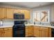 Efficient kitchen featuring modern gas stove, overhead microwave, and sleek countertops at 8916 Evening Star Dr, Las Vegas, NV 89134