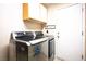 Laundry room with stainless steel washer and dryer, plus ample storage space at 8916 Evening Star Dr, Las Vegas, NV 89134