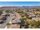 Aerial view showcasing community, nearby mountain views, and desert landscape at 941 Armandito Dr, Las Vegas, NV 89138