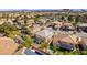 A high-angle view showcases the house, pool and the surrounding neighborhood and community at 941 Armandito Dr, Las Vegas, NV 89138