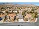 Aerial view of suburban neighborhood with mountain views and a manicured lawn at 941 Armandito Dr, Las Vegas, NV 89138