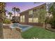 A private backyard featuring a custom pool and spa, with mature landscaping at 941 Armandito Dr, Las Vegas, NV 89138