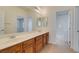 Bathroom featuring a double sink vanity with cabinets and tile flooring at 941 Armandito Dr, Las Vegas, NV 89138