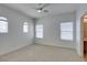 Bedroom featuring plush carpet, a modern ceiling fan, and ample natural light at 941 Armandito Dr, Las Vegas, NV 89138