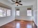 Bedroom with hardwood floors, neutral paint, and a large window for natural light at 941 Armandito Dr, Las Vegas, NV 89138