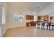 Dining area flowing into the kitchen with a large countertop and barstool seating at 941 Armandito Dr, Las Vegas, NV 89138