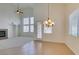 Living room flowing into the dining and sitting area with a fireplace at 941 Armandito Dr, Las Vegas, NV 89138