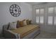 Bright bedroom featuring plantation shutters and a decorative wall clock at , Las Vegas, NV 89118