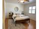 This bedroom features a light wood floor, area rug, shuttered window, and a bed with matching nightstand at , Las Vegas, NV 89118