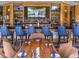 Fully stocked bar with seating and TVs at 1 Ibis Ct, Henderson, NV 89052