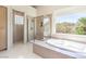 Bright bathroom with walk-in shower, soaking tub and ample natural light at 1 Ibis Ct, Henderson, NV 89052