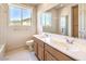 Well-lit bathroom with dual sinks and shower-tub combo at 1 Ibis Ct, Henderson, NV 89052