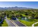 Elegant entrance sign to Anthem Country Club with stone masonry, flower beds and lush trees at 1 Ibis Ct, Henderson, NV 89052