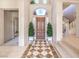 Welcoming foyer boasts a grand entrance with decorative tile flooring and a staircase at 1 Ibis Ct, Henderson, NV 89052