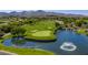 Picturesque community golf course view with a pond, fountain, and lush green landscape, offering a serene and recreational environment at 1 Ibis Ct, Henderson, NV 89052