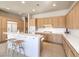 Spacious kitchen features wood cabinets, white countertops, and a breakfast bar at 1 Ibis Ct, Henderson, NV 89052