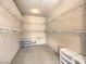 Spacious walk-in closet featuring built-in shelving at 1 Ibis Ct, Henderson, NV 89052