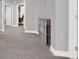 Carpeted hallway with gray accents and built-in storage at 1016 Tropic Wind Ave, North Las Vegas, NV 89081