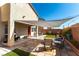 Well-maintained backyard with patio, artificial turf, and shade, perfect for entertaining at 10745 Leatherstocking Ave, Las Vegas, NV 89166