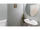 Neat half bath with a single sink, toilet, and towel rack at 10745 Leatherstocking Ave, Las Vegas, NV 89166