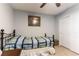 Cozy bedroom featuring a comfortable bed, neutral walls, a ceiling fan, and a closet at 10745 Leatherstocking Ave, Las Vegas, NV 89166