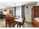 Inviting dining room featuring a wood table, complementary chairs, and stylish decor at 10745 Leatherstocking Ave, Las Vegas, NV 89166