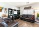 Inviting living room featuring a leather sofa set, built-in shelving, and natural light at 10745 Leatherstocking Ave, Las Vegas, NV 89166