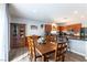 Spacious kitchen, dining area, and island blend seamlessly for great flow and an inviting space at 10745 Leatherstocking Ave, Las Vegas, NV 89166