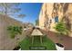 Virtually staged backyard with dining table and plants at 11103 African Sunset St, Henderson, NV 89052