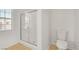 Bathroom featuring a walk-in shower, toilet, and bright window at 11103 African Sunset St, Henderson, NV 89052