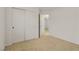 This bedroom has neutral carpet and closet with paneled doors at 11103 African Sunset St, Henderson, NV 89052