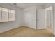 This bedroom has neutral carpet, a window with blinds, and closet with paneled doors at 11103 African Sunset St, Henderson, NV 89052