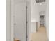 Hallway with carpeting leading to bedroom doors and access to upper floor at 11103 African Sunset St, Henderson, NV 89052