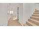 Entryway features neutral walls, carpeted staircase and flooring, and access to the backyard at 11103 African Sunset St, Henderson, NV 89052