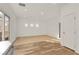 Bright and airy living room featuring updated kitchen and ample natural light at 11103 African Sunset St, Henderson, NV 89052