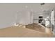Open-concept living space with updated kitchen with stainless steel appliances and adjacent dining area at 11103 African Sunset St, Henderson, NV 89052