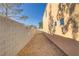 Narrow side yard with a rock bed at 11103 African Sunset St, Henderson, NV 89052