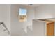 Bright staircase with a window view and updated railing at 11103 African Sunset St, Henderson, NV 89052