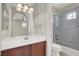 Bathroom featuring granite counters, a glass enclosed shower and vanity at 11354 Merado Peak Dr, Las Vegas, NV 89135