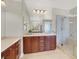 Bathroom includes dual vanities, tile flooring, glass shower and spacious cabinets at 11354 Merado Peak Dr, Las Vegas, NV 89135